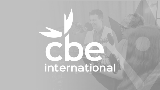 Three people speaking into microphones during a recording session, with the CBE International logo overlaid on the image.
